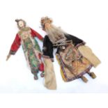 A Pair of Chinese Painted Composition Marionettes, wearing traditional costume with embroidered