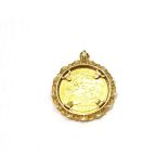 An 1897 half sovereign loose mounted as a pendant . 9 carat gold mount. Gross weight 6.59 grams.