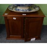 A mahogany table top canteen, the two panelled cupboard doors opening to reveal four fitted and