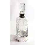 An Elizabeth II silver-mounted cut-glass decanter and stand, the silver mount and stand by Carrs,
