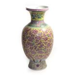A modern Chinese vase, four character marks, yellow ground with all-over famille rose decoration,