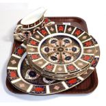 A set of six Royal Crown Derby Old Imari pattern dinner plates, 27cm diameter; with a meat plate,