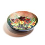 Moorcroft pottery shallow circular bowl, spring flowers pattern
