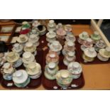 Five trays of mainly 20th century coffee cans and saucers, to include examples by Shelley, Susie