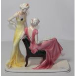 ^ Katzhutte Art Deco figure group, modelled as two elegant ladies, one seated reading a letter,