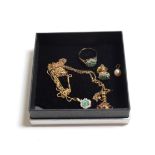 A 9 carat gold gem set suite including stud earrings, ring, finger size L1/2; and pendant on