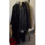 Modern ladies winter coats including a Maviche swing style black leather and suede striped coat;