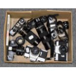 Eight cameras including Minolta SRT303 with 100mm lens; three Pentax; and Minolta X-700