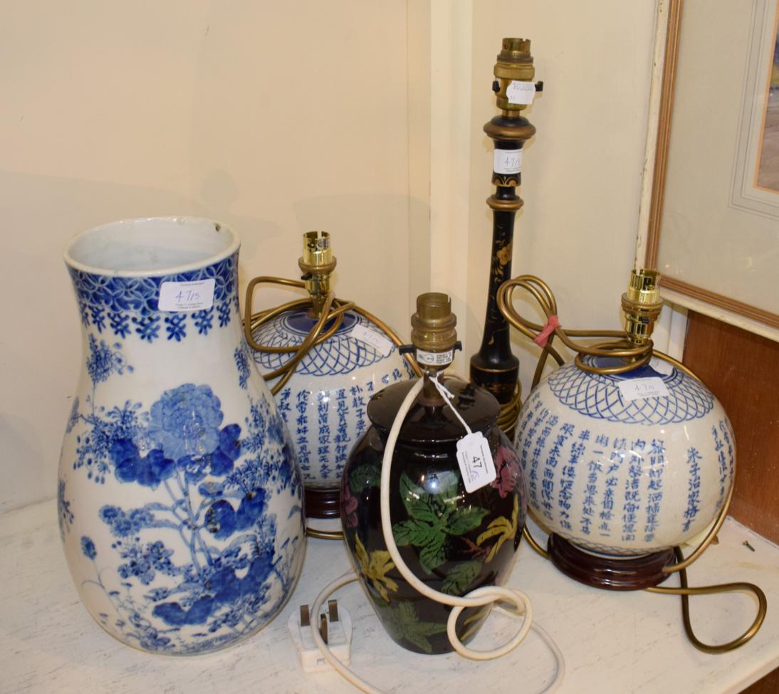 ^ A group of modern chinoiserie table lamps, including a pair of globular ceramic blue and white