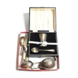 Silver comprising Indian silver ovoid infuser, by Hamilton & co; cased egg cup and spoon set; and