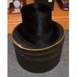 Silk top hat by G A Dunn & co Piccadilly circus London, with cardboard hat box and a military