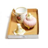^ Royal Worcester small pot pourri in the form of a shell and a candle snuffer in the form of a hat;