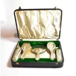 A Walker & Hall silver backed five-piece dressing table set, cased