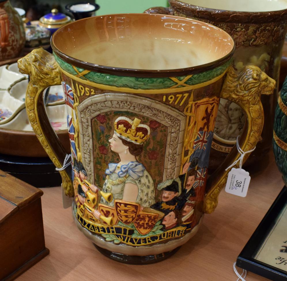 A Royal Doulton Queen Elizabeth II loving cup 76/250, with certificate of authenticity (2)