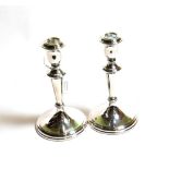 A pair of Elizabeth II silver candlesticks, by Carrs, Sheffield, 2005, each in the Georgian-style