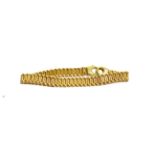 A fancy link bracelet stamped '750', length 22.5cm . Gross weight 33.80 grams