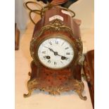 ^ A French red tortoiseshell and brass inlaid mantel clock