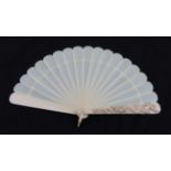 A Circa 1880's Ivory Brisé Fan, the upper guard heavily carved with a winged Angel carrying a child,