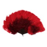 A Vibrant Red Feather Fan, bi-coloured, circa 1900, the curly feathers mounted on tortoiseshell, the