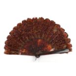 A Good Pheasant Feather Fan, circa 1880's, the monture a large brisé fan in tortoiseshell, with