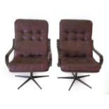 A Pair of 1970's Danish Design Swivel Armchairs, with leather cushions, bentwood arms and