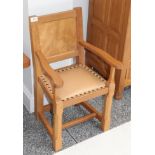 A Carthouse Furniture of Thirsk English Oak Childs Panel Back Arm Chair, with shaped arms, nailed