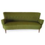 A Danish Design 1950's Sofa, of curved form, upholstered in green wool with button back, on beech
