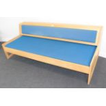A Danish Design Beech Framed Studio Couch, in the manner of Hans Wegner, covered in blue fabric with