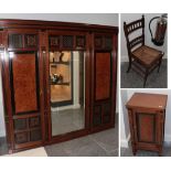 An Aesthetic Movement Walnut, Ebonised and Burr Triple Door Mirrored Wardrobe, the stepped cornice