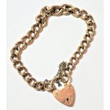 A curb link bracelet, each link stamped '9' '.375, length 20cm . Gross weight 26.21 grams.