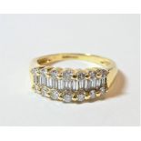 An 18 carat gold diamond three row ring, total estimated diamond weight 0.75 carat approximately,
