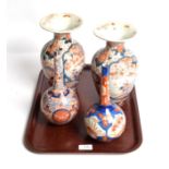 A pair of Japanese Imari baluster vases, 19th century, everted rims; with two bottle vases (4)