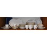 A Limoges dinner service with floral borders together with eight Royal Worcester tea cups and