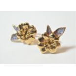 A pair of 9 carat gold enamel earrings, floral studs with enamelled leaves, with post fittings.
