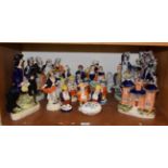 A collection of Staffordshire figures, Toby pepperettes, cottages etc