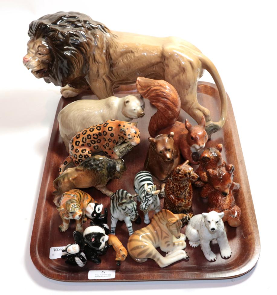 A collection of wild animals including Melba Ware lion and various other animal models