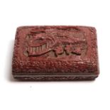 A Chinese cinnabar lacquer box and cover, bears Qianlong reign mark, of cushioned rectangular form