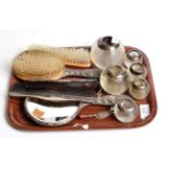 Six various silver mounted match strikers, a three piece silver backed dressing table set, two