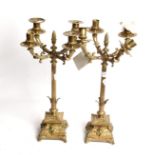 A pair of Victorian brass candelabras