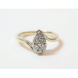 An 18 carat white gold pear shaped diamond cluster ring, total estimated diamond weight 0.25 carat