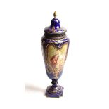 A metal mounted Sèvres style pottery urn and cover, circa 1900, of baluster form, decorated with
