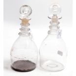 A near pair of triple ring neck mallet decanters and stoppers, early 19th century, 28cm high