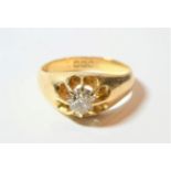An 18 carat gold diamond solitaire ring, an old cut diamond in a yellow claw setting to a plain