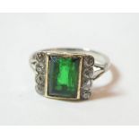 A green stone and diamond ring, finger size N1/2. Gross weight 2.85 grams. Unmarked.