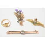 A 9 carat gold amethyst thistle brooch, length 4cm, a 9 carat gold RAF brooch, length 4.2cm (a.f); a