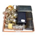 A collection of silver napkin-rings, including: two cased pairs: one cased pair engine-turned and