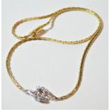 An 18 carat gold diamond set necklace, length 42cm (central stone missing). Gross weight 14.13