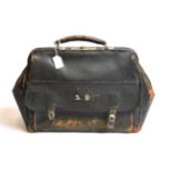 A Victorian gentleman's leather Gladstone bag, fitted inside with four silver-mounted dressing-table