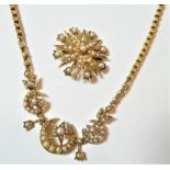 A seed pearl necklace, length 37cm; and a seed pearl brooch/pendant, measures 2.5cm . Both pieces