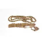 A 9 carat gold rope twist necklace, length 41cm; and a gate link bracelet with heart shaped clasp